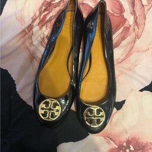 Tory Burch Glossy Black Flats with Gold Emblem